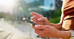 Phone, scroll and hands of businesswoman in city with legal email, communication or texting on mobile app. Technology, professional and female attorney with cellphone for contact on law case in town.