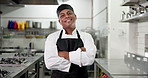 Face, chef and happy man with arms crossed in kitchen for catering, hospitality and gastronomy. Portrait, smile and culinary artist with confidence, professional cook and mature expert in restaurant
