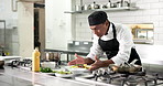 Plate, man and chef in kitchen for cooking at restaurant for meal preparation, presentation or garnish. Food, hospitality career and male culinary worker for cuisine flavor with catering at diner