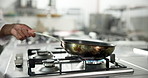 Chef, hand and cooking with pan in kitchen, catering process and frying with oil in restaurant. Skillet, person and meal prep with culinary worker for cuisine, food recipe and flame on gas stove