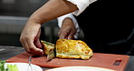 Hands, chef and beef wellington in restaurant kitchen, cutting and catering service with meal order. Person, cooking and cuisine for food with culinary skills, gourmet dish and pastry at diner
