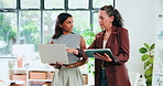 Conversation, laptop and tablet with business people in office for internship or project management. App, computer or design with employee and mentor woman in workplace for feedback or review