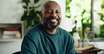 Face, black man and smile in home on weekend morning, positive attitude and resting on off day. Happiness, laughing and portrait of mature person with free time in apartment, peace and calm for break