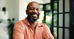 Home, face and black man with smile, arms crossed and confidence with property owner. Rental apartment, real estate and mature person in lounge, happiness and pride with investment and mortgage