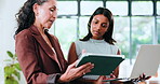 Mentor, review or women in office with tablet, explain or feedback on article idea. Collaboration, intern or journalist in agency with laptop, editorial assessment or manager advice on digital report