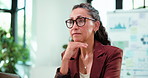 Reading, thinking and typing with business woman in office for analytics or problem solving. Glasses, report and research with mature employee at work on computer for data analysis or planning