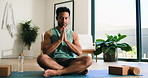 Happy man, yoga and inner peace with meditation in home for spiritual wellness or mental wellbeing. Calm, male person or zen with namaste for breathing exercise, awareness or mindfulness in house