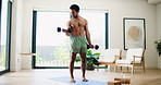 Man, fitness and bicep curl with dumbbells in home for arm exercise, muscle gain or training. Active, muscular or male person with equipment or weightlifting for workout or health on mat in house