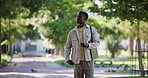 Student, man and walking with phone at university for semester start, explore campus and learning. Education, black person and smartphone outdoor for college tour, scholarship opportunity and study