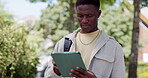 Black man, student outdoor and scroll with tablet for college, environmental study and education. Person, typing and tech at university campus for ecology degree, academic scholarship and knowledge.