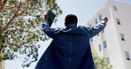 Man, student and cheering with tablet outdoor for good news, education and college acceptance. Back, low angle and male person with fist pump for learning achievement, scholarship winner and success