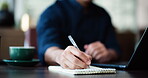 Man, hands and writing on notebook for business, planning and calendar reminder at laptop. Employee, notes and computer in office for task management, efficiency an agenda schedule update in email