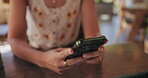 Woman, hands and typing in cafe with phone for social media post, online chat and text message. Female person, browsing and internet search in coffee shop with tech for mobile app, website and blog.