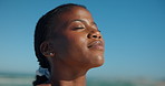 Beach, eyes closed and black woman with vacation, calm and travel with freedom. Seaside, tourism and African person with summer holiday, peaceful and oxygen in environment, weekend trip and wellness
