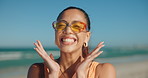 Happy, frame and woman with sunglasses, beach or photography on summer vacation, laughing or travel. Outdoor, traveler and person with hand gesture for holiday, carefree and memory in California