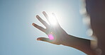 Blue sky, flare or hand of person with sunshine, block glare or shade eyes for protection from intense light. Vision support, uv rays or woman shield face to prevent sunburn, mockup space or outdoor