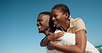 Funny, couple and running with piggyback on beach for playful game, travel adventure or bonding. Low angle, happy black people and carry at seaside for weekend getaway, relationship support and laugh