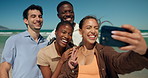 Selfie, happy and friends by beach with peace sign for summer vacation, holiday and weekend together. Outdoor, travel and people with photo by ocean for bonding, relax and memory for social media