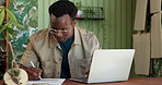 Laptop, clipboard and black man in plant nursery with research for leaf growth, ecology or botany. Computer, writing and African male botanist with online inventory for greenery in garden center.