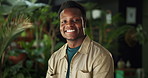 Happy, black man and face of botanist in nursery with confidence for eco friendly career. Smile, laugh and portrait of African male environmental consultant by greenery for botany in garden center.