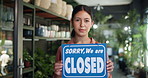 Woman, closed sign and botanist at shop, face or sustainability with board at small business. Person, florist and smile at store front, portrait or notice with pride at eco friendly startup in Mexico