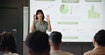 Business woman, graphs and presentation for training in seminar room with audience. Education, forum speech and statistics with corporate growth for public speaking, strategy and convention for crowd