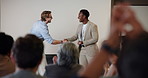Business people, applause and handshake for award at seminar ceremony, celebration and smile. Clap, shaking hands or giving trophy for achievement, congratulations or success with conference audience