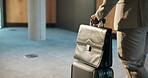 Business travel, employee and hand with suitcase, airport and realtor with international opportunity. Walking, legs and trip for property investment, real estate and person with luggage on journey