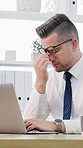 Headache, laptop and typing with business man at desk in office for burnout, eye strain or pressure. Computer, stress and tension with employee in workplace for deadline, migraine or frustration