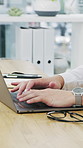 Business, hands or typing on laptop in office for article, news report or fact check with research. Keyboard, journalist or person with computer for story review, publication or editing draft at desk