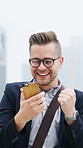 Fist pump, winning and businessman with phone in city for good news, stock market success and bonus. Corporate, outdoor and excited person on smartphone for investment, promotion and profit in town