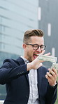 Happy, business man or money rain in city for investment return, trade earnings or financial freedom. Excited, trader and cash throw outdoor for stock market wealth, bonus celebration and cashback