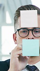 Think, business man and writing on sticky note for financial strategy, planning or agenda in office. Glass wall, problem solving and investor brainstorming with idea for investment, schedule or scrum