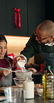 Christmas, dad or child in kitchen with baking, sifting support or bonding in holiday season. Festive, love or family in house with learning, connection or dessert preparation in cooking tradition.