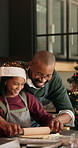 Father, child and dough at house for Christmas holiday, rolling pastry and bonding together. Smile, family and kid for learning recipe for sweet treat, festive tradition and helping with xmas cookies