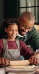 Father, kid and dough at house for Christmas holiday, rolling pastry and bonding together. Smile, family and child for learning recipe for sweet treat, festive tradition and helping with xmas cookies