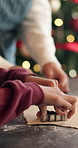 Hands, child and baking with dough at house for Christmas holiday, learning skills and cookie cutter. Bokeh, family and kid with pastry for festive shapes, homemade treats and help with xmas dessert
