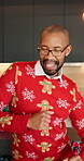 Christmas, man and happy with dancing in home for celebration, festive season and holiday energy. People, male person and movement in house for xmas playlist, december entertainment and performance