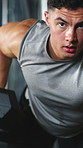 Exercise, dumbbell and face of man in gym with training, bicep growth and health. Equipment, athlete and male person with weightlifting workout, practice or fitness with strength in sports center