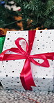 Christmas, box and gift with tree in home for festive celebration, santa surprise or tradition. Empty, red ribbon and package with present on floor for december holiday giveaway, decor or offering