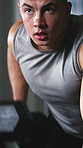 Exercise, dumbbell and man in gym with training, bicep growth and weightlifting. Equipment, athlete and male person for health with intense workout, practice or fitness with strength in sports center