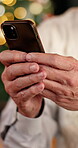 Christmas, texting and hands with smartphone, online and communication with contact on social media. Typing, message and person with mobile on December holiday, networking and chat on website or Xmas