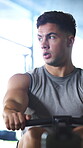 Rowing machine, workout and training with man in gym for fitness, cardio challenge or bodybuilder. Exercise equipment, wellness and person in sport club for health, energy and muscle development