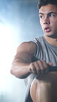 Rowing machine, fitness and training with man in gym for workout, cardio challenge and bodybuilder. Exercise equipment, wellness and athlete or person in sport club for health and muscle development