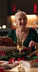 Christmas, dinner party or woman laugh at table, funny conversation or sharing meal for holiday celebration. Festive bonding, speaking or senior person with family in home, food or joke for reunion