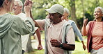 Fitness, nature and senior people with high five in park with workout, health or wellness training. Coach, walk and elderly friends in retirement with cardio exercise outdoor in garden with teamwork.