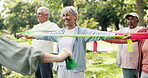 Resistance band, fitness and class with old woman in nature for workout, stretching and health. Exercise, retirement and wellness with senior people learning in park for personal trainer and club