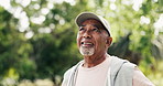 Happy, thinking and senior man outdoor for fresh air, wellness and active hobby for health. Park, smile and elderly person in nature for exercise, fitness and workout for wellbeing, rest and calm