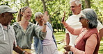 Personal trainer, exercise and old people in park, high five and support with workout goals. Outdoor, instructor and mature group with smile, health and wellness achievement with success and fitness