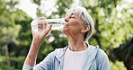Fitness, old woman and drink water outdoor for health, wellness or hydration for active retirement. Exercise recovery, bottle and thirsty senior person with detox liquid, mineral nutrition or break